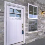 White wooden front door with sash windows